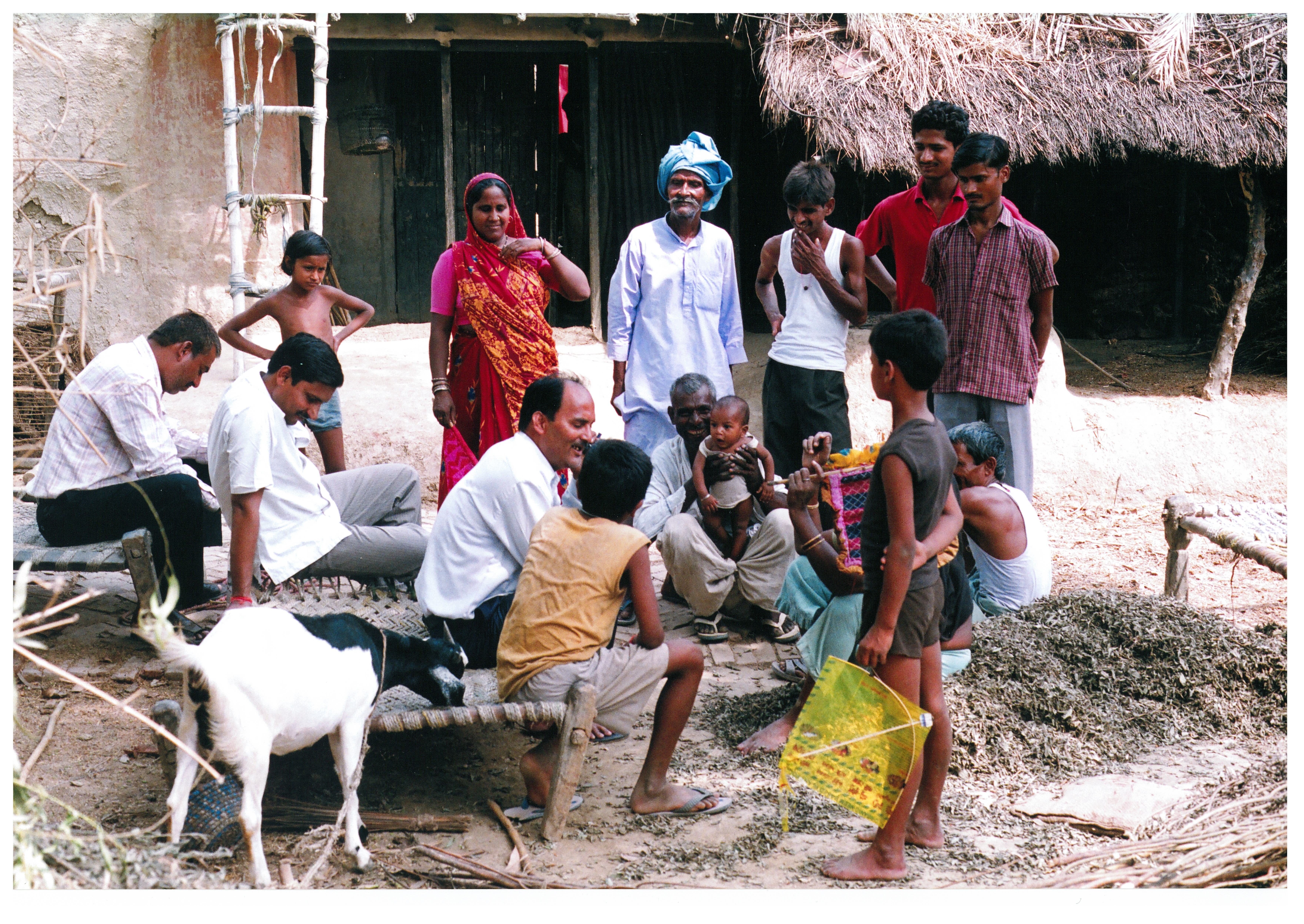   In this photo, everyone, including the baby, appears to be paying attention to the person sitting in the center. Rakesh took this photo in 2007 when he visited his village in India where he spent first two years of his life.  This was his first visit to the village in nearly 50 years. 